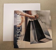 Gutschein Present Papiertüte grau/schwarz